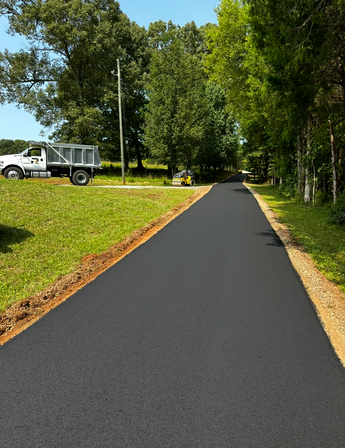 Paving Peace of Mind: A Smooth New Drive Through the Woods in Charlotte